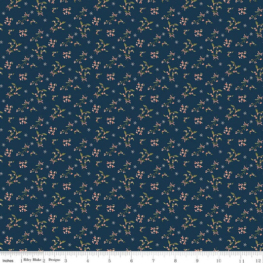 Navy blue fabric with small floral pattern and ruler at the bottom