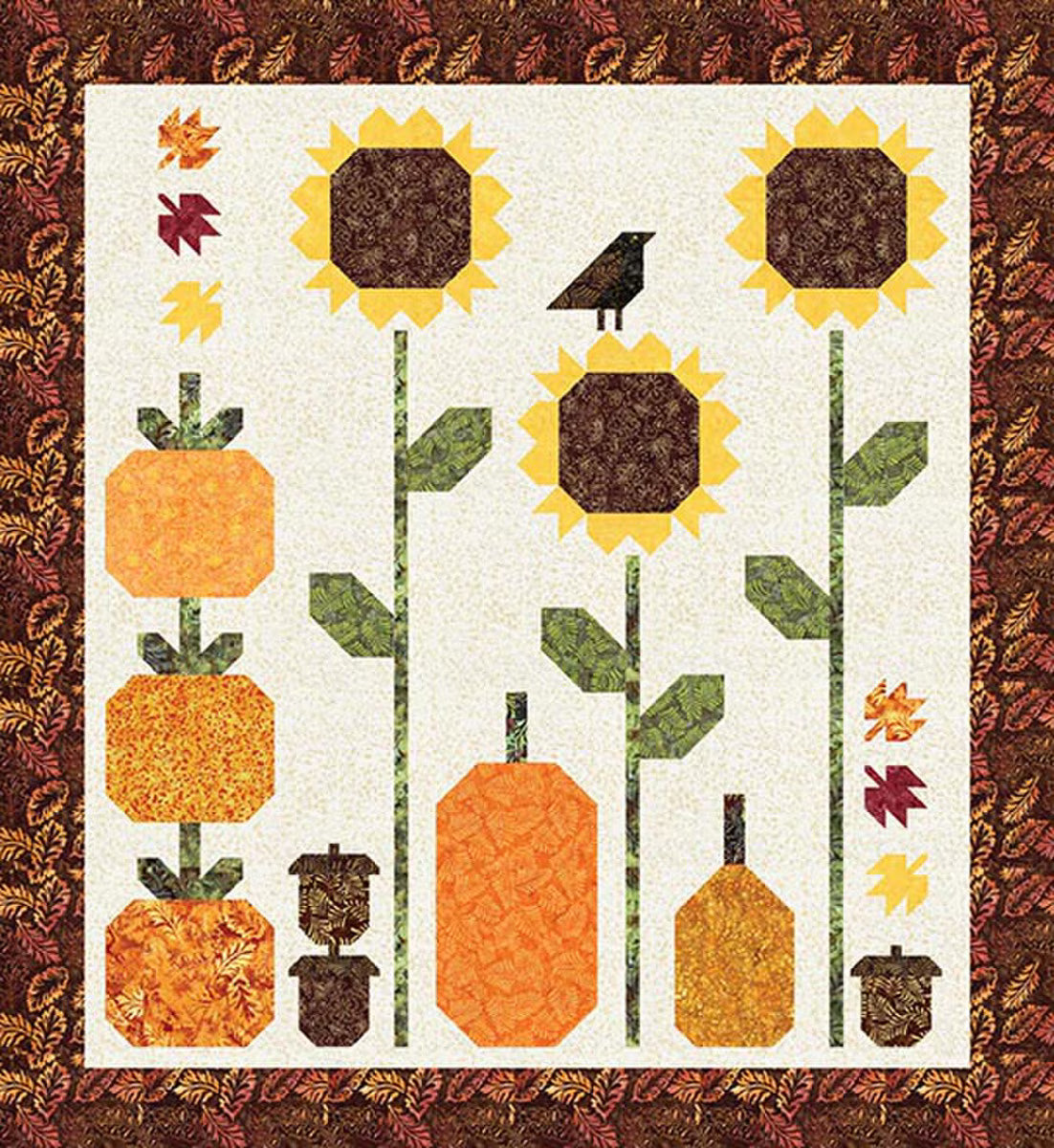 Quilt pattern with sunflowers, pumpkins, and leaves on a white background
